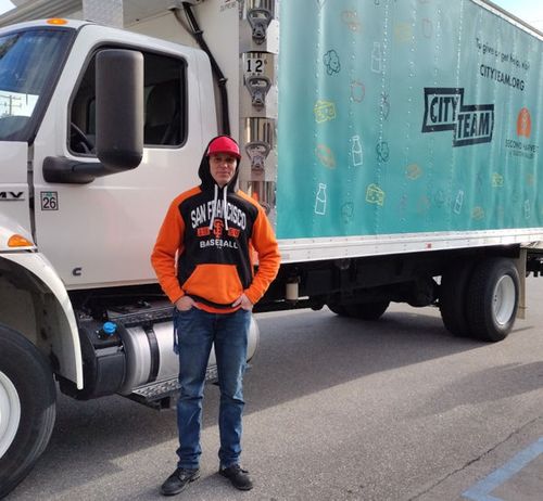 Frank standing in front of a CityTeam truck